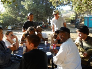 Community members playing uno during a rehearsal break, 2010.